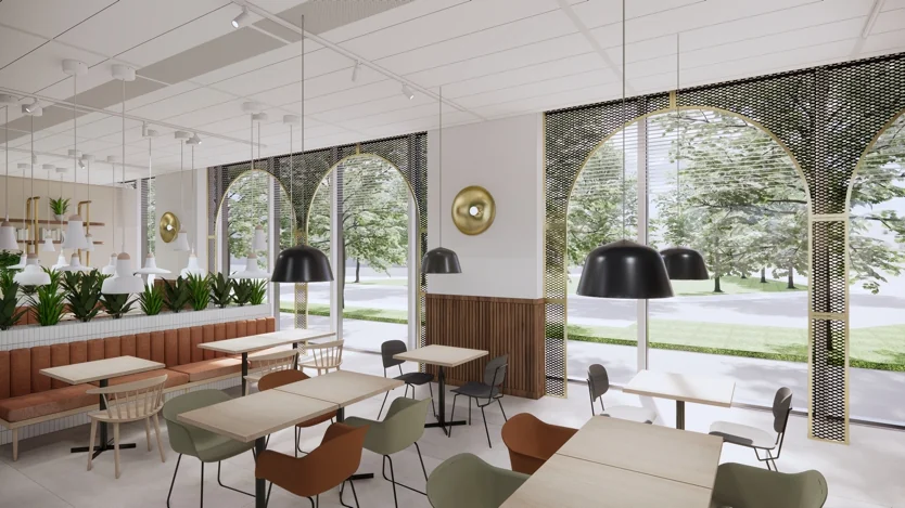 Modern ingericht café aan de Europalaan met grote ramen, diverse zitplaatsen en veel natuurlijk licht.