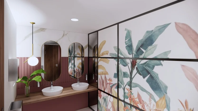 Modern ingerichte toiletruimte aan de Europalaan met tropisch plantenmotief op de muur en dubbele wastafel met ovale spiegels.