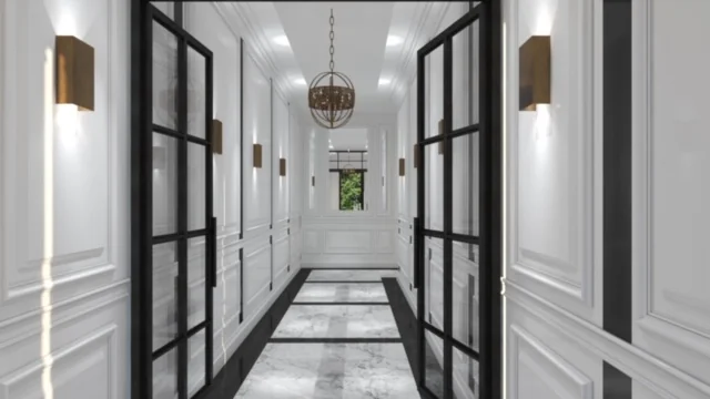 Luxe witte gang met marmeren vloer, zwarte stalen deuren en moderne wandverlichting aan de Koningslaan.
