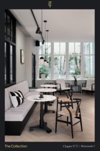 Stijlvol ingerichte zithoek met moderne meubels en grote ramen in Westermarkt 2, Chapter Nº 3 van The Collection.