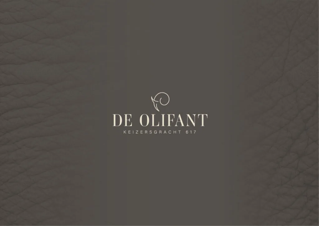 Logo van De Olifant op een donkere leren achtergrond met het adres Keizersgracht 617.
