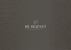 Logo van De Olifant op een donkere leren achtergrond met het adres Keizersgracht 617.