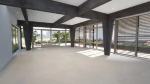 Licht en modern interieur met houten balken, grote ramen en uitzicht op een groene tuin.