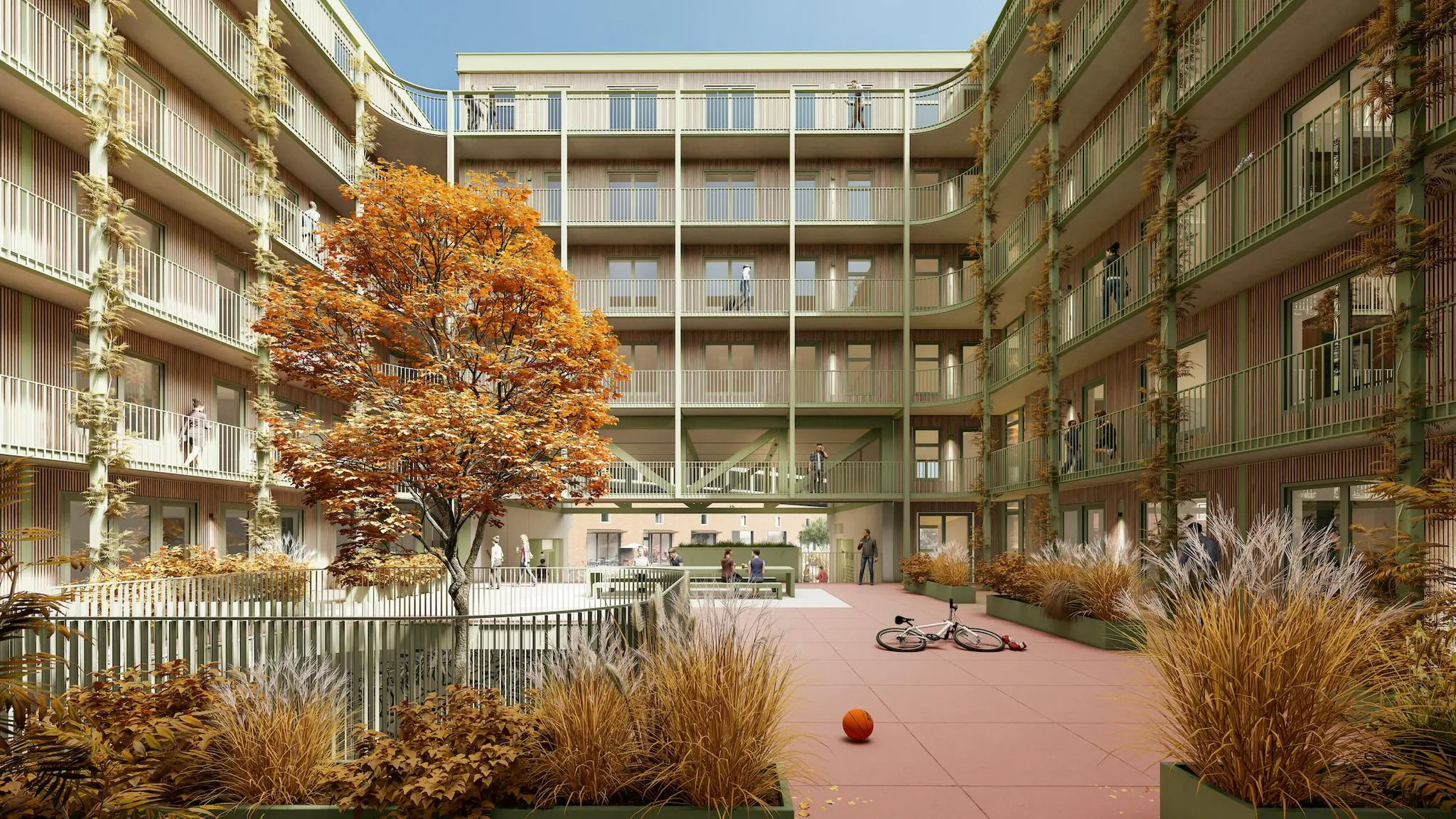 Binnenplaats van een modern appartementencomplex aan de Cartesiusweg met herfstkleurige beplanting, spelende kinderen en een geparkeerde fiets.
