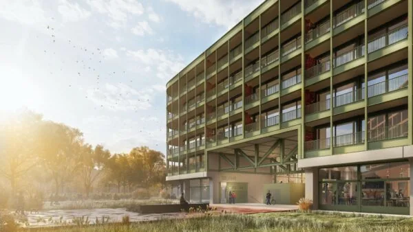 Moderne groene woontoren aan de Cartesiusweg met balkonverdiepingen en omliggende parkachtige omgeving.