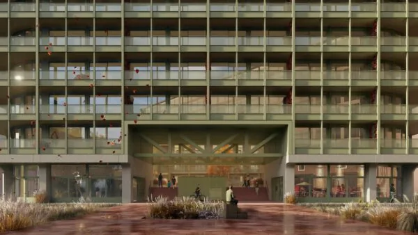 Vooraanzicht van een modern appartementencomplex aan de Cartesiusweg met balkons, glazen gevel en een doorgang naar de binnenplaats.