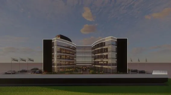 Modern kantoorgebouw op Stationspark, symmetrisch van vorm en omringd door vlaggen en geparkeerde auto's.