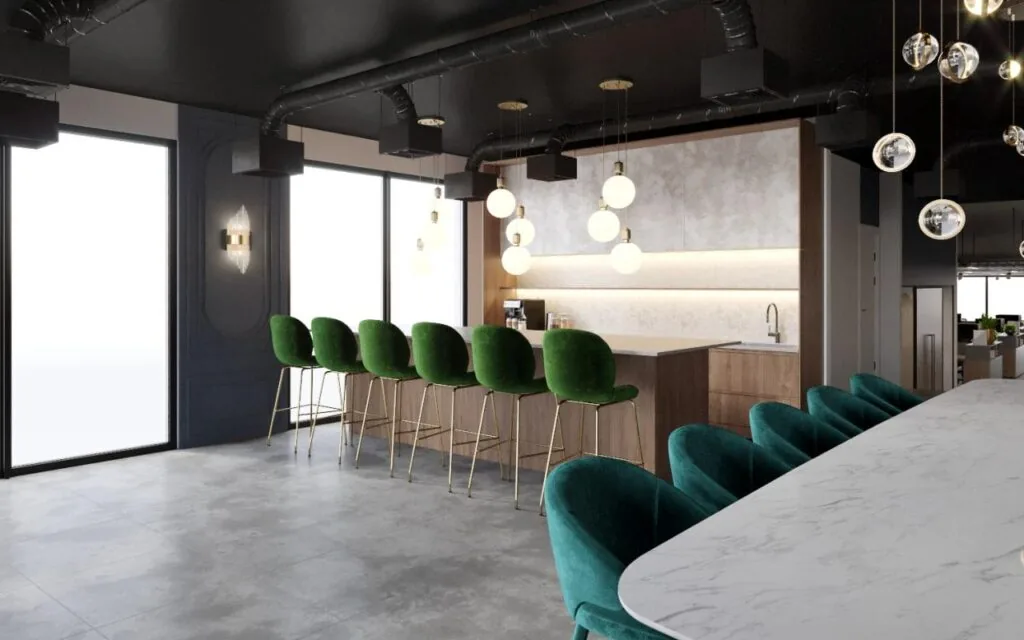 Moderne kantoorruimte aan de Grasweg met een open keuken, een marmeren tafel en groene fluwelen barkrukken.