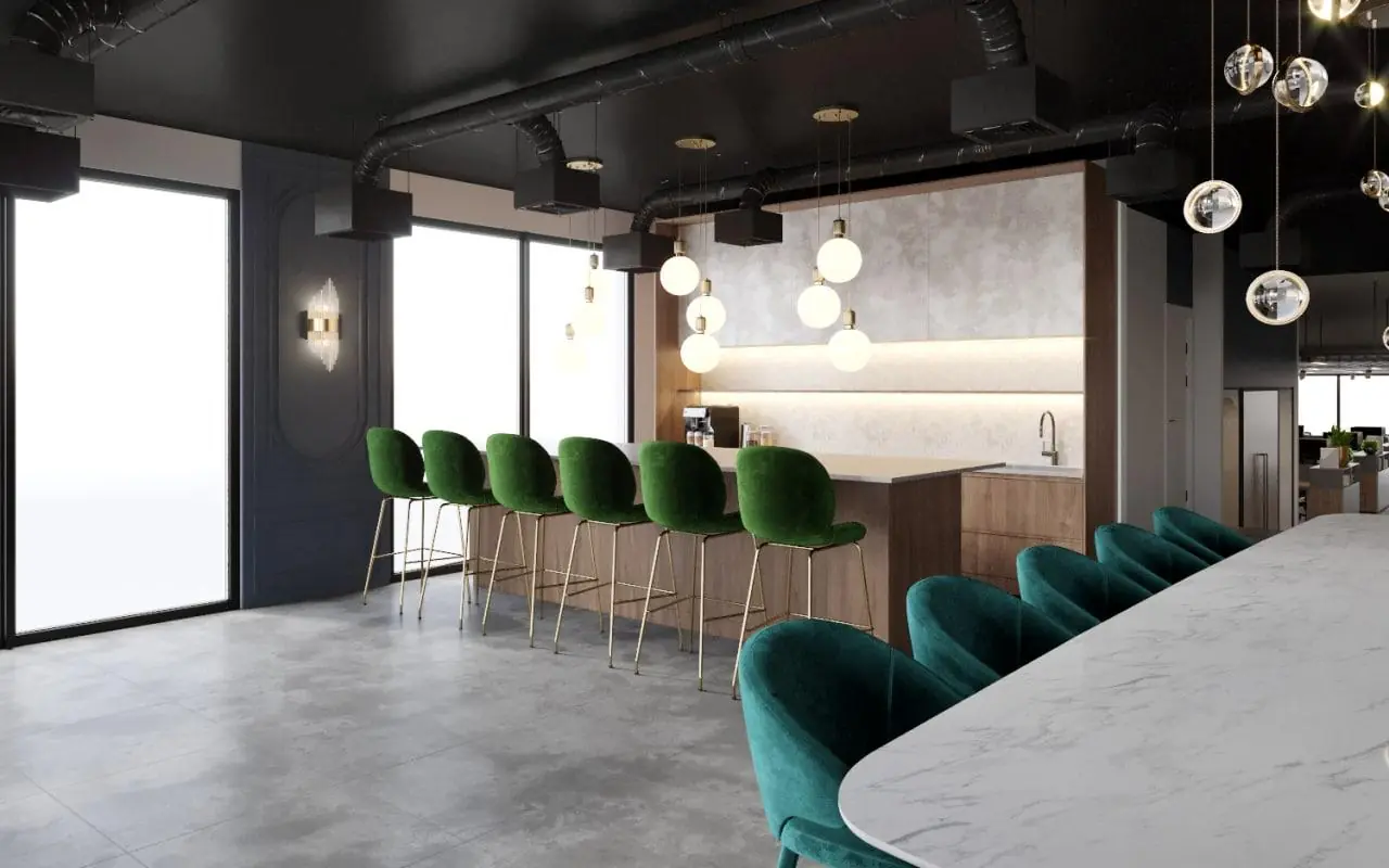 Moderne kantoorruimte aan de Grasweg met een open keuken, een marmeren tafel en groene fluwelen barkrukken.