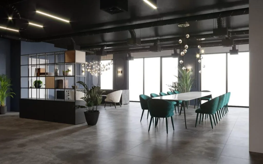 Moderne vergaderruimte aan de Grasweg met een lange tafel, groene stoelen, plafondverlichting en grote ramen.