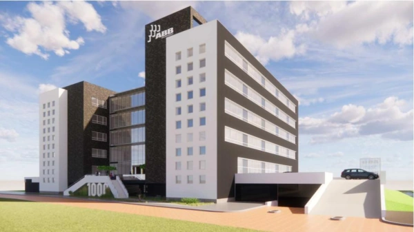 Moderne kantoorgebouw van ABB aan het Stationspark met een oprijlaan en parkeergarage.