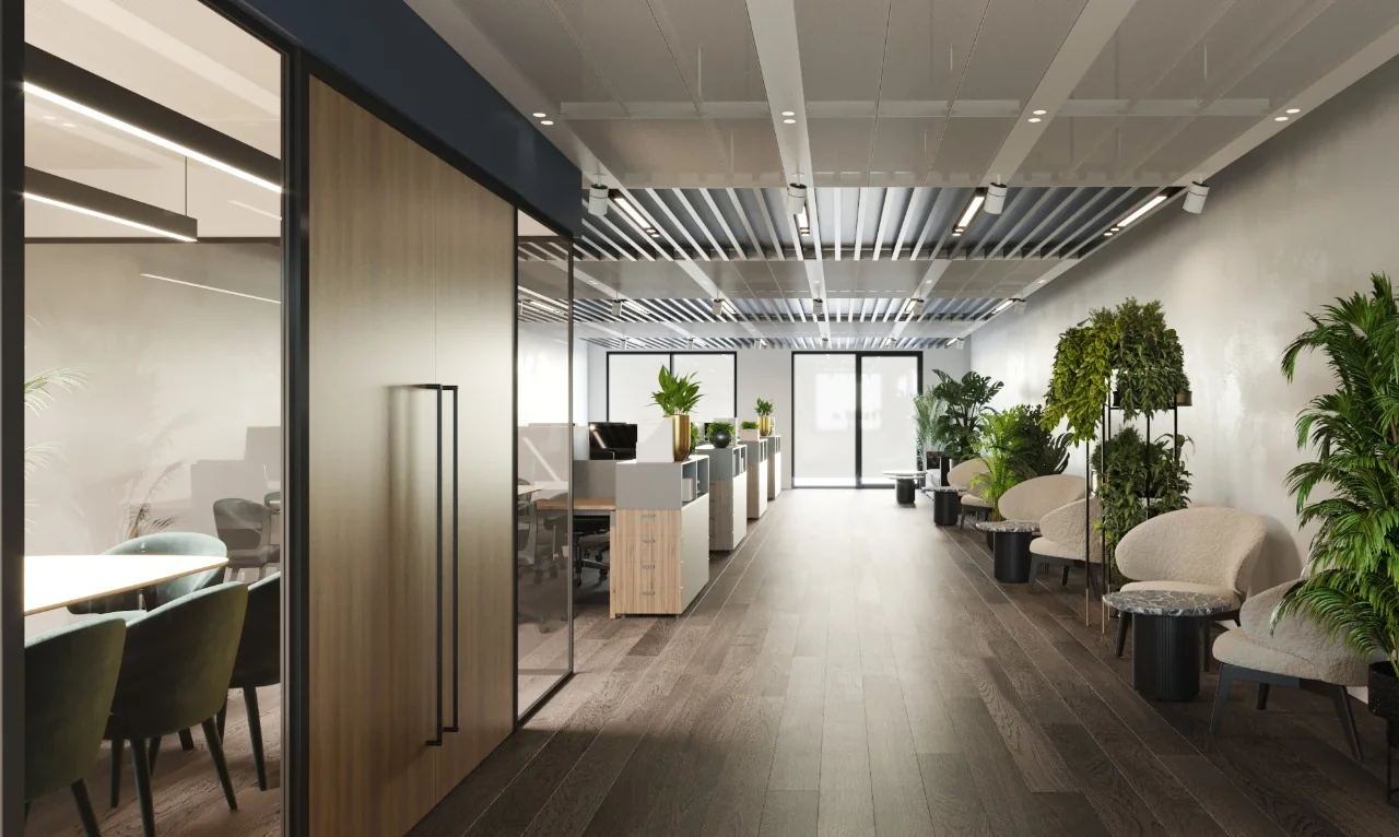 Moderne kantoorruimte aan de Grasweg met werkplekken, vergaderruimte en een wachtruimte met veel planten.