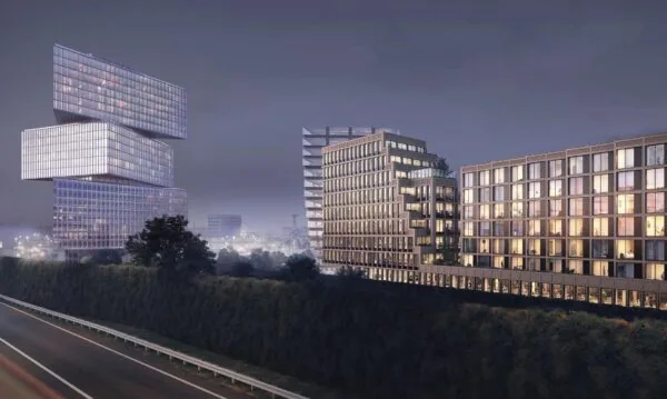 Moderne kantoorgebouwen en appartementencomplexen aan de Gelrestraat bij avondzicht.