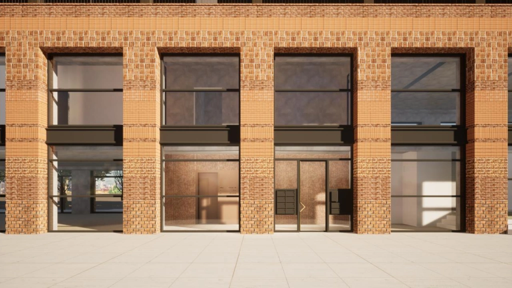 Vooraanzicht van de bakstenen gevel en entree van een modern gebouw aan de Papaverweg.