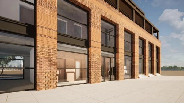 Moderne bakstenen gevel met grote glazen puien aan de Papaverweg onder een blauwe lucht.