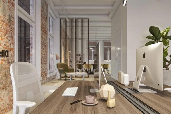 Modern kantoorinterieur aan het Rokin met houten bureaus, iMacs, designmeubilair en een industriële bakstenen muur.
