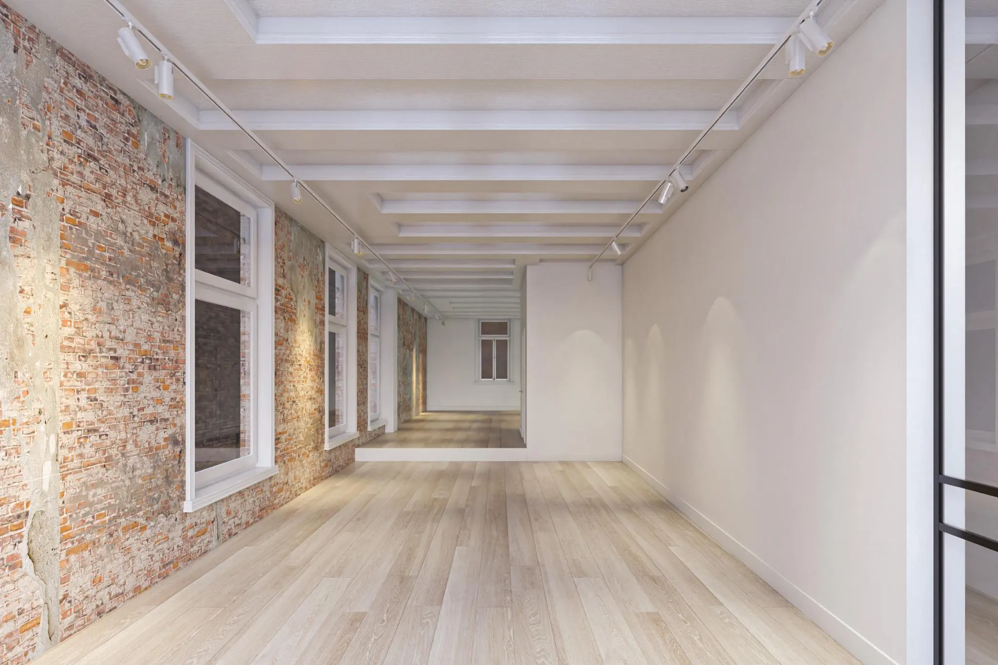 Leeg, modern gerenoveerd interieur met houten vloer, bakstenen muur en plafond met spots aan het Rokin.