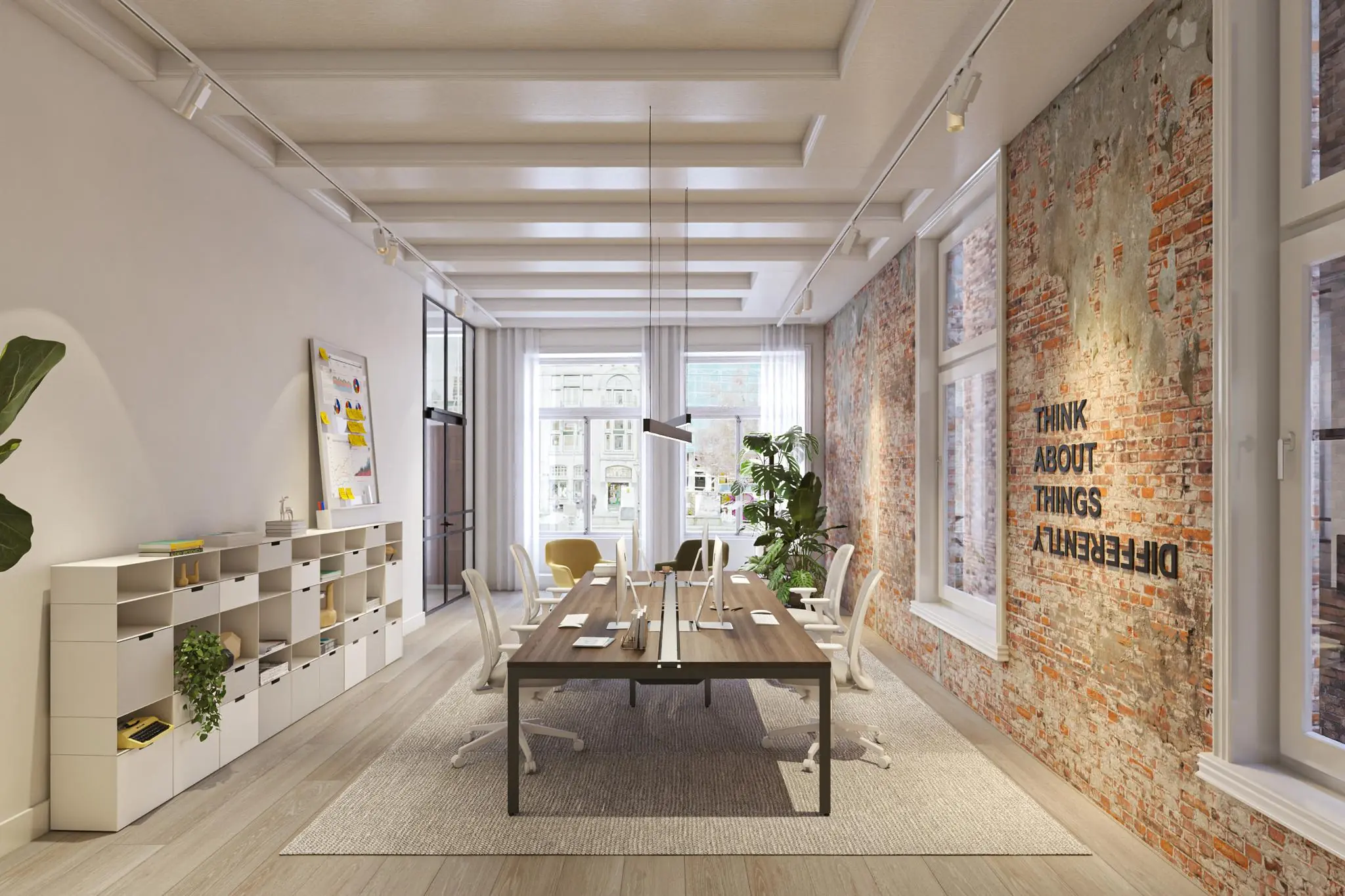 Modern kantoorinterieur aan het Rokin met een lange werktafel, bakstenen muur en de tekst "Think about things differently".