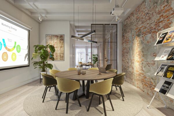 Moderne vergaderruimte aan het Rokin met ronde tafel, projectiescherm en industriële bakstenen muur.