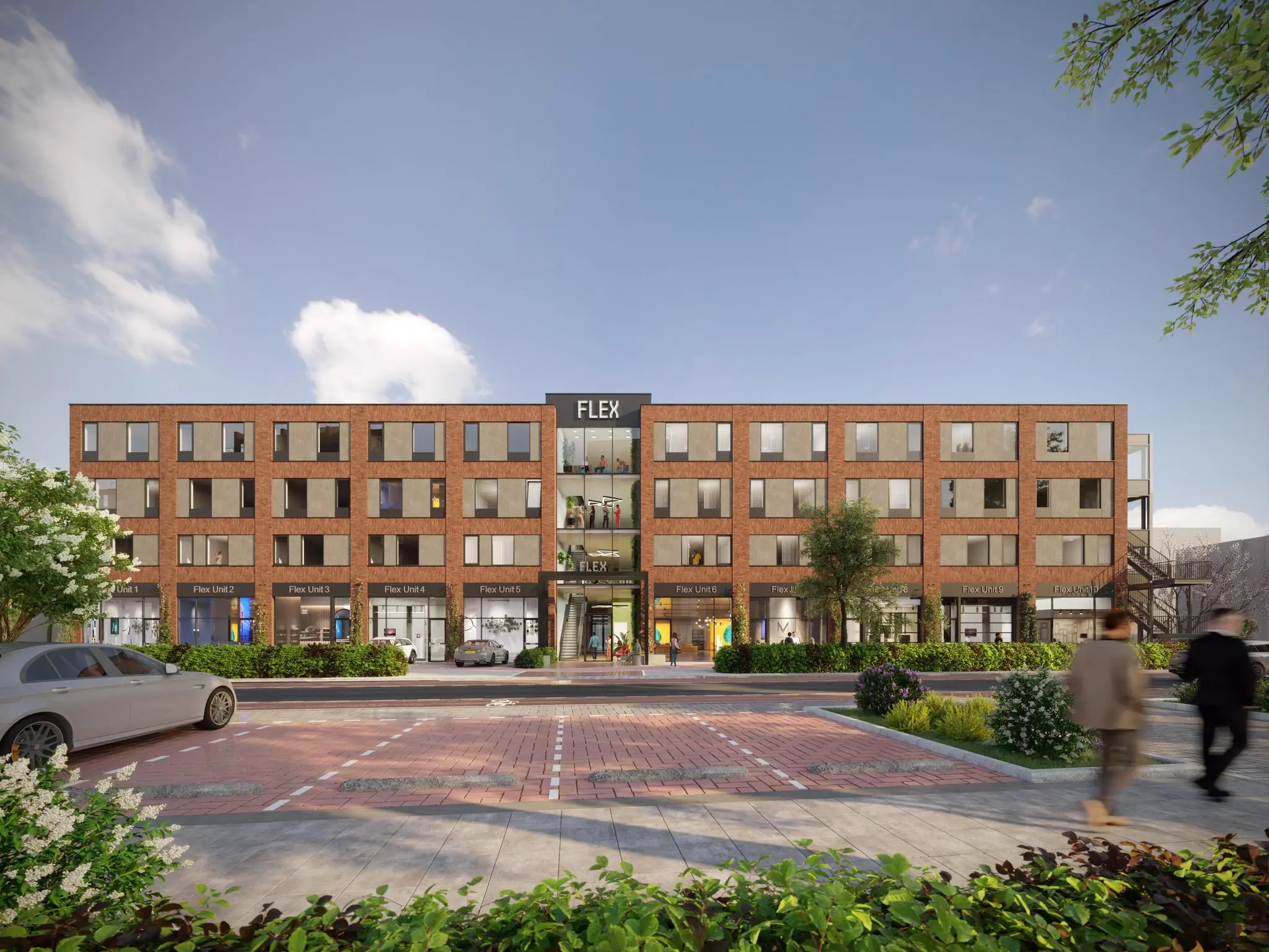 Straatbeeld van het moderne bedrijfsverzamelgebouw FLEX aan de Treubstraat met meerdere flex units en een bakstenen gevel.