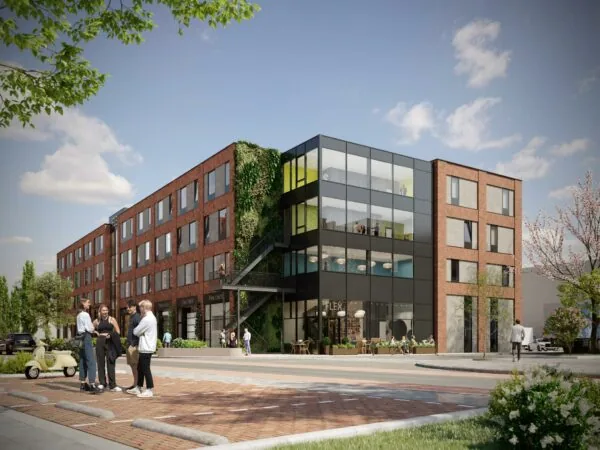 Modern kantoorgebouw aan de Treubstraat met bakstenen gevel, grote ramen en een groene gevelpartij.