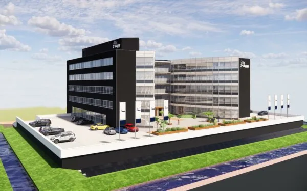 3D-render van het Stationspark kantoorgebouw met parkeerruimte, ABB-logo en omliggende groene zones.