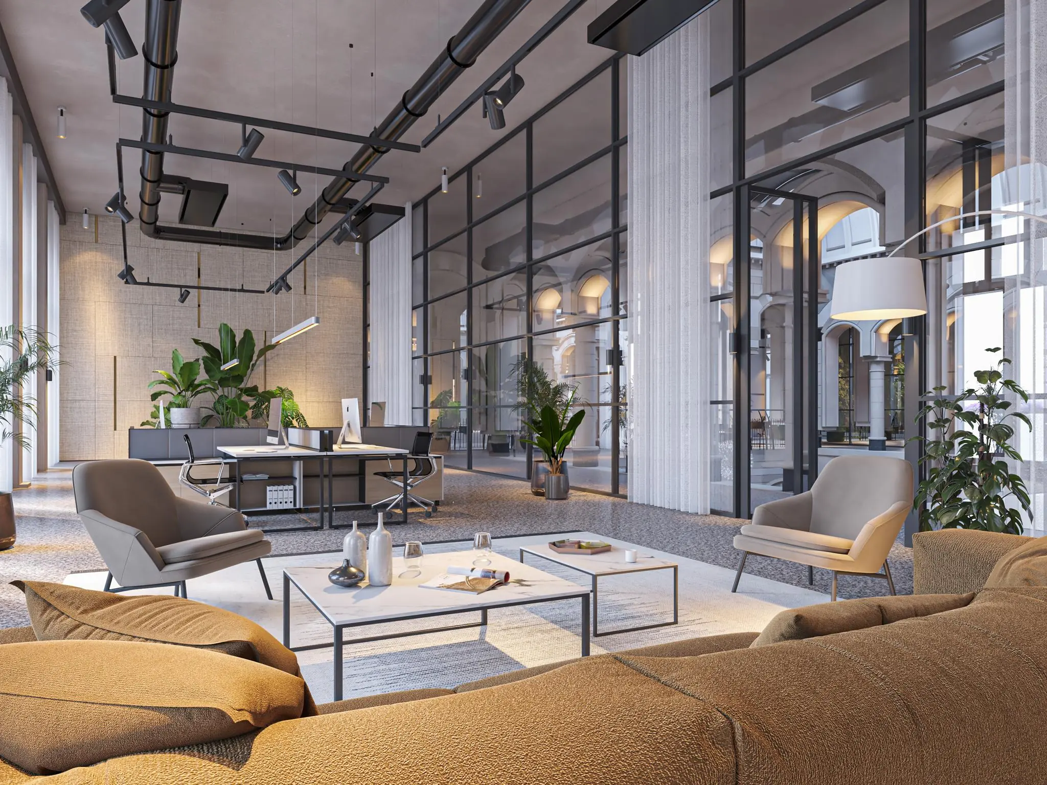 Modern ingerichte lounge- en werkruimte aan de Nieuwezijds Voorburgwal met glazen wanden, designmeubilair en veel natuurlijk licht.