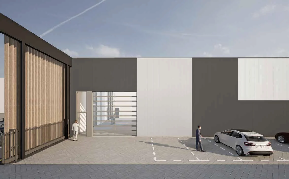 Moderne bedrijfsgebouw aan de Strickledeweg met parkeerplaatsen en glazen entree.