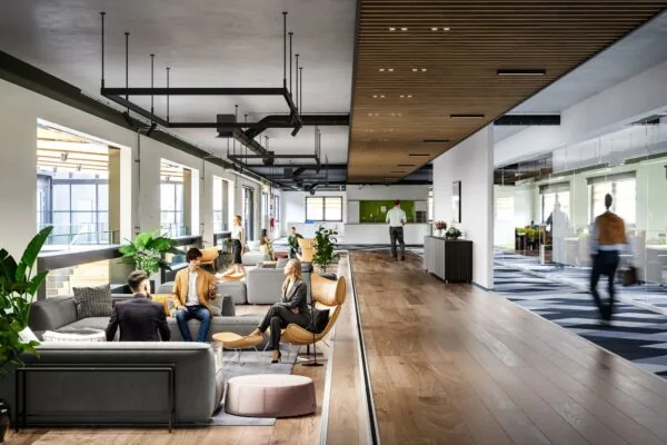 Moderne kantoorruimte aan de Laarderhoogtweg met loungegedeelte, houten vloer en glazen vergaderruimtes.