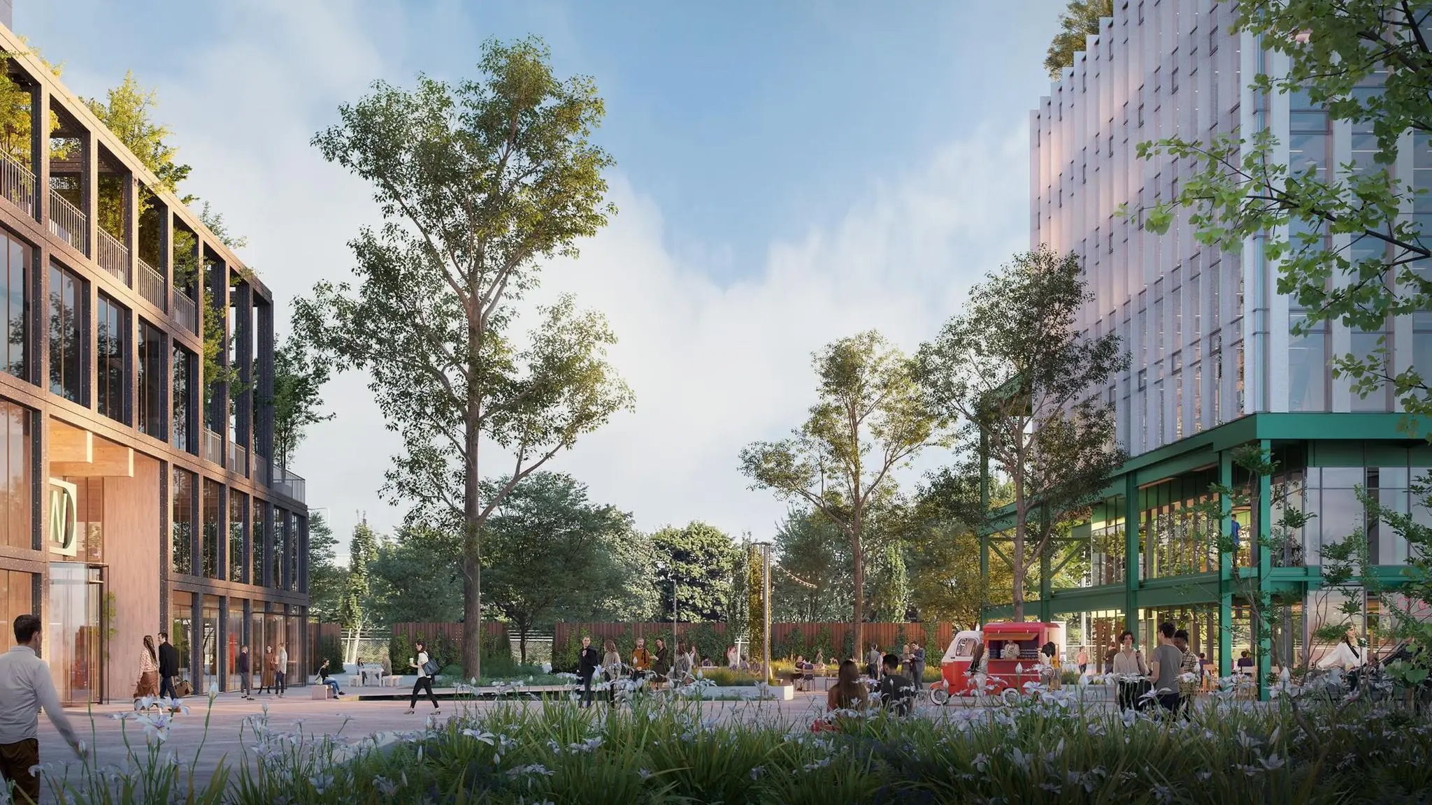 Stadsplein aan de Basisweg met moderne gebouwen, groen en mensen in een levendige, openbare ruimte.