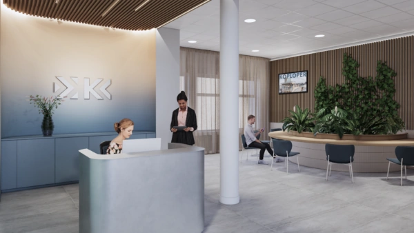 Moderne ontvangstruimte van Stationsplein met balie, wachtruimte, plantenwand en medewerkers.