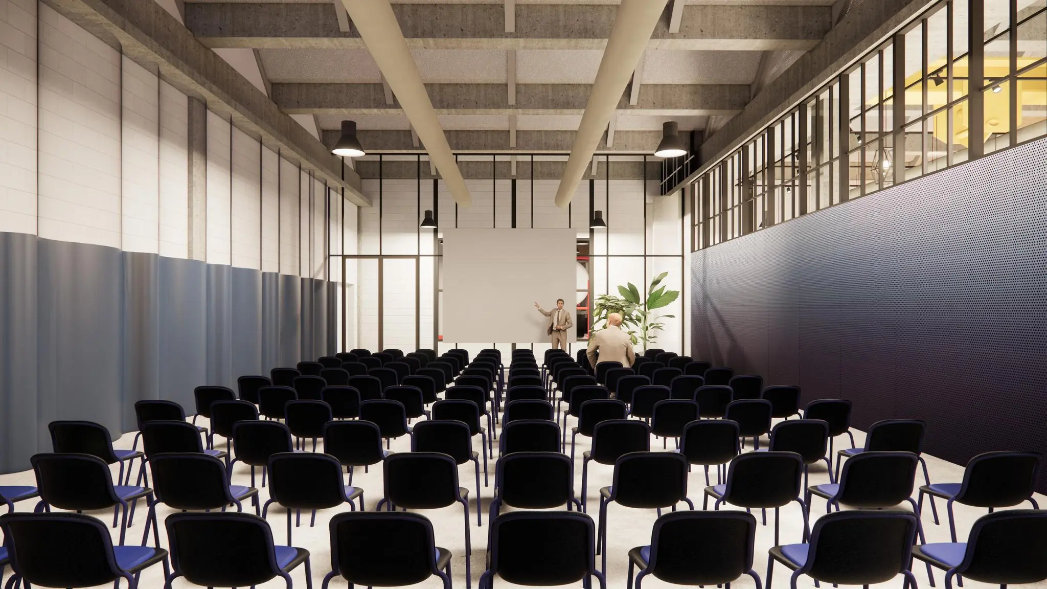 Een moderne presentatieruimte aan de Sluisjesdijk met rijen stoelen, een projectiescherm en twee mensen bij het podium.