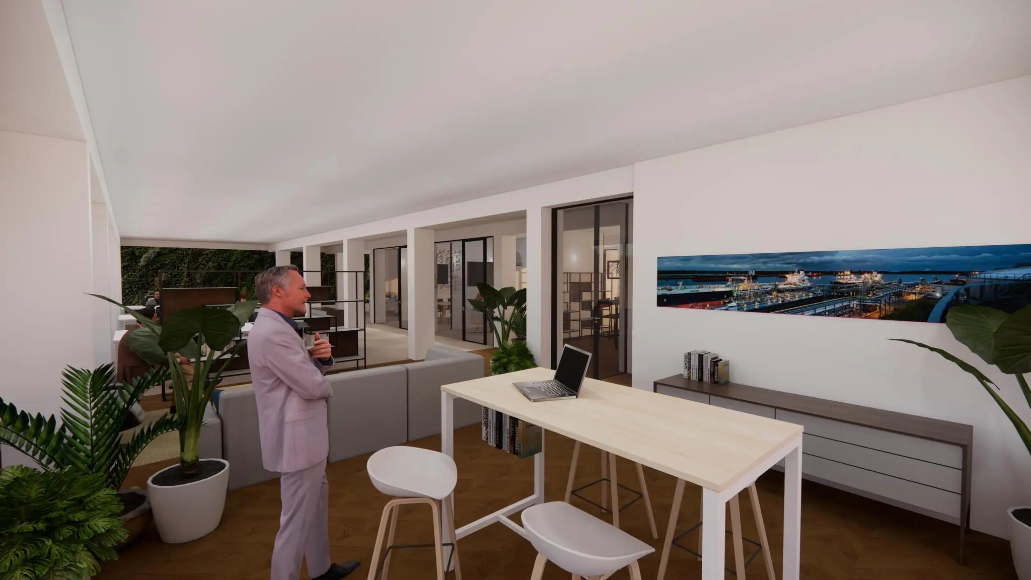 Man in pak staat met een kop koffie in een modern kantoor aan de Volmerlaan met veel glas, planten en een grote foto van een industriegebied aan de muur.