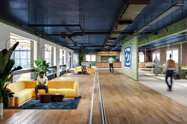 Moderne en kleurrijke kantoorruimte aan de Laarderhoogtweg met zithoeken, planten en een open keuken.