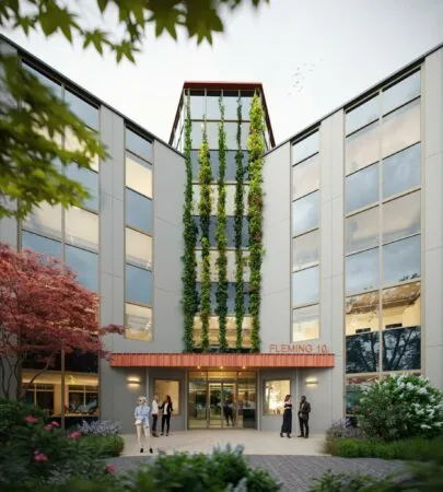 Modern kantoorgebouw aan de Fleminglaan 10 met groene gevelbegroeiing en glazen entree.