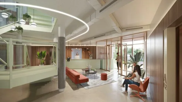 Moderne wachtruimte met zitgedeelte, receptiebalie en natuurlijke lichtinval aan de Fleminglaan.