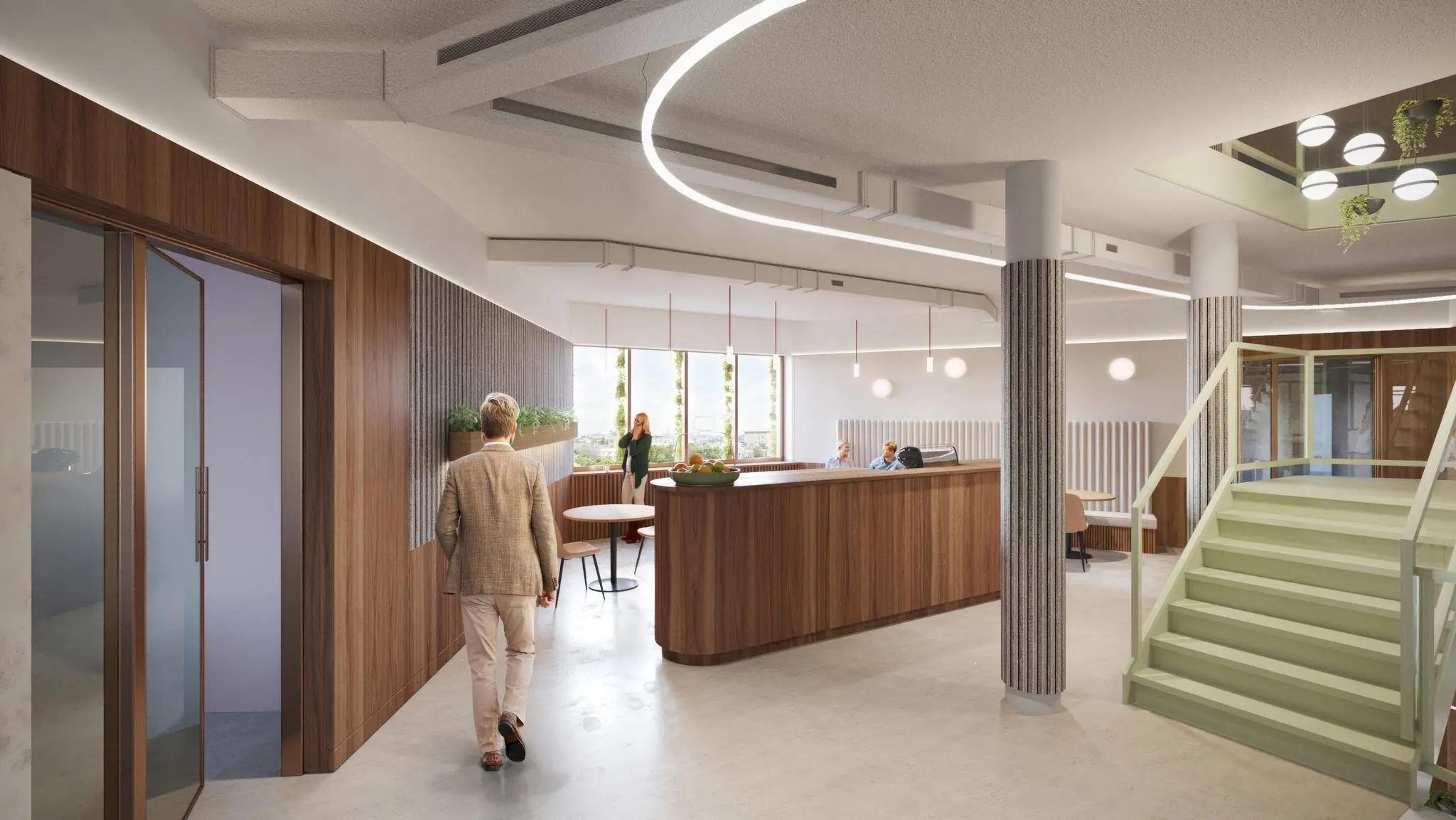 Moderne en open kantoorruimte aan de Fleminglaan met houten balie, zithoek en groene trap.
