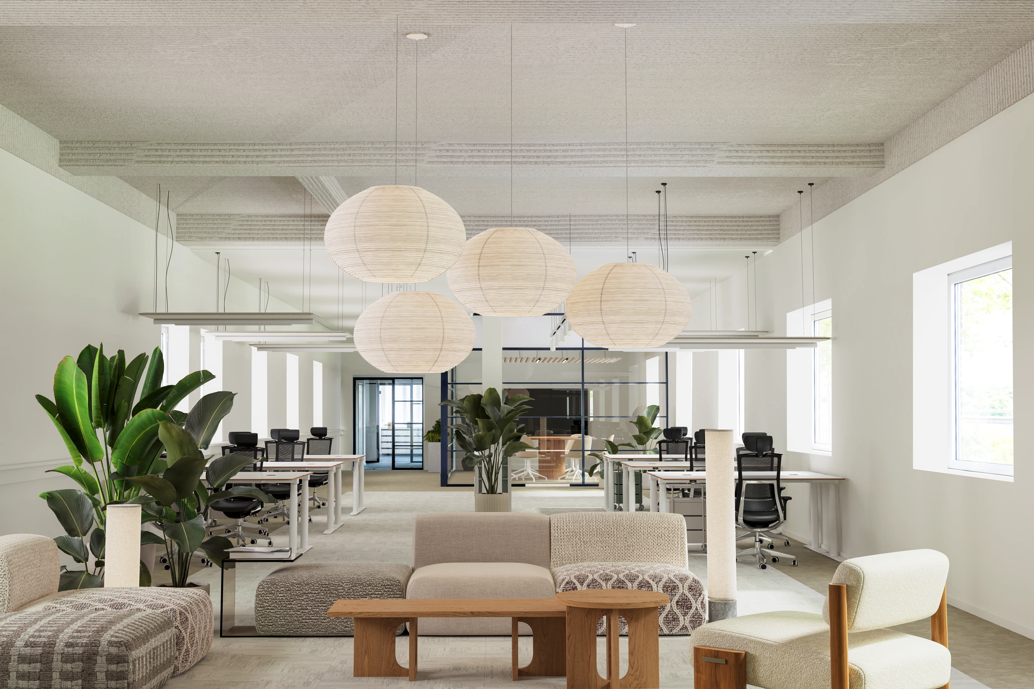 Modern en licht kantoorinterieur aan de Vliegtuigstraat met open werkplekken, planten en sfeervolle hanglampen.