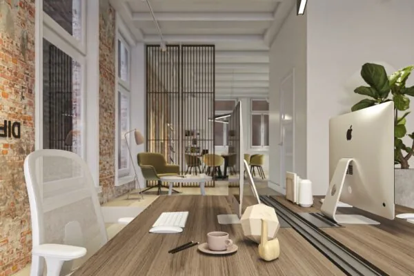 Modern kantoorinterieur aan het Rokin met houten bureaus, iMacs, designmeubilair en een industrieel bakstenen muur.