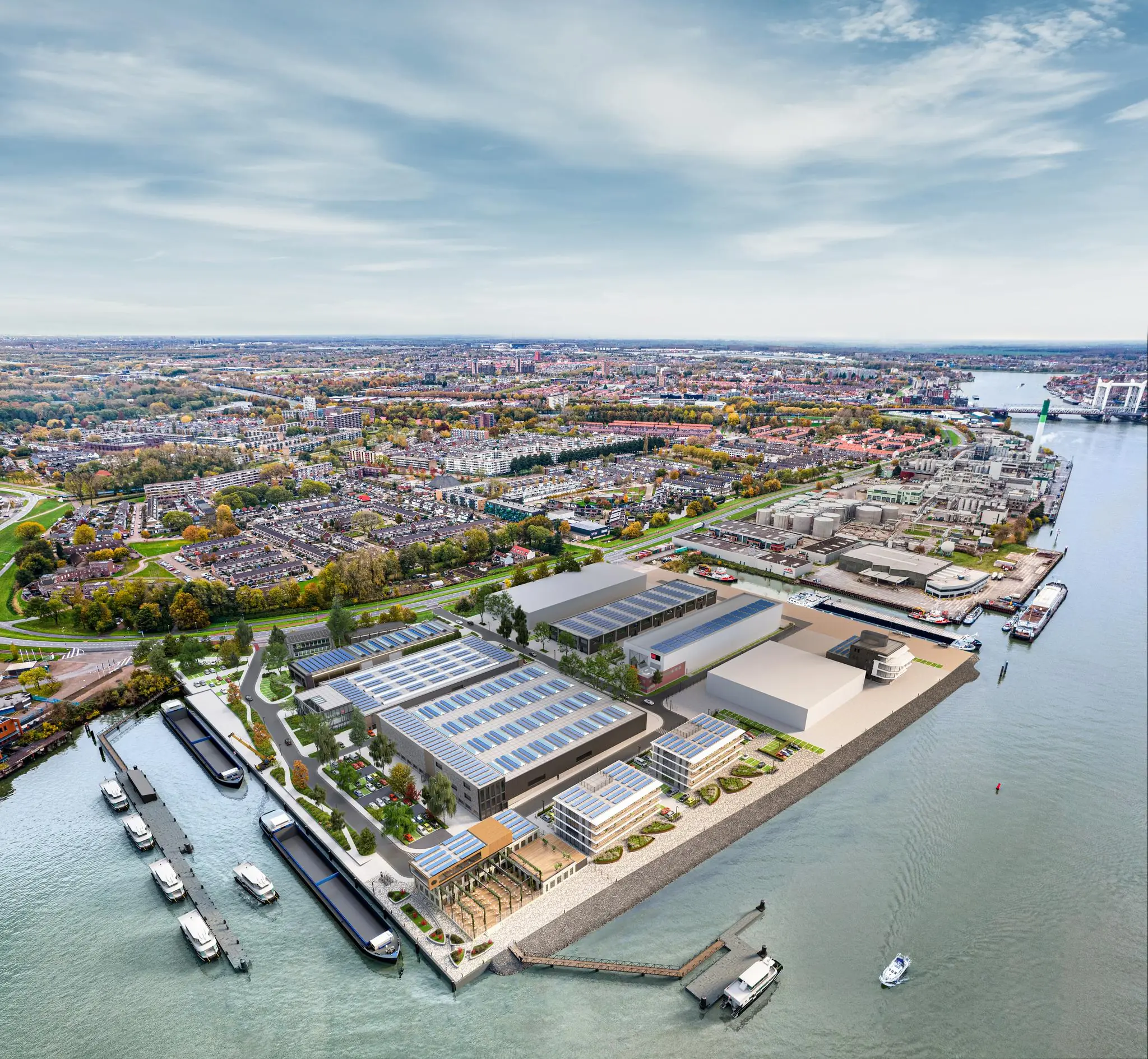 Luchtfoto van de Lindtsedijk met een herontwikkeld waterfront en omliggende woonwijken en havengebied in Zwijndrecht.