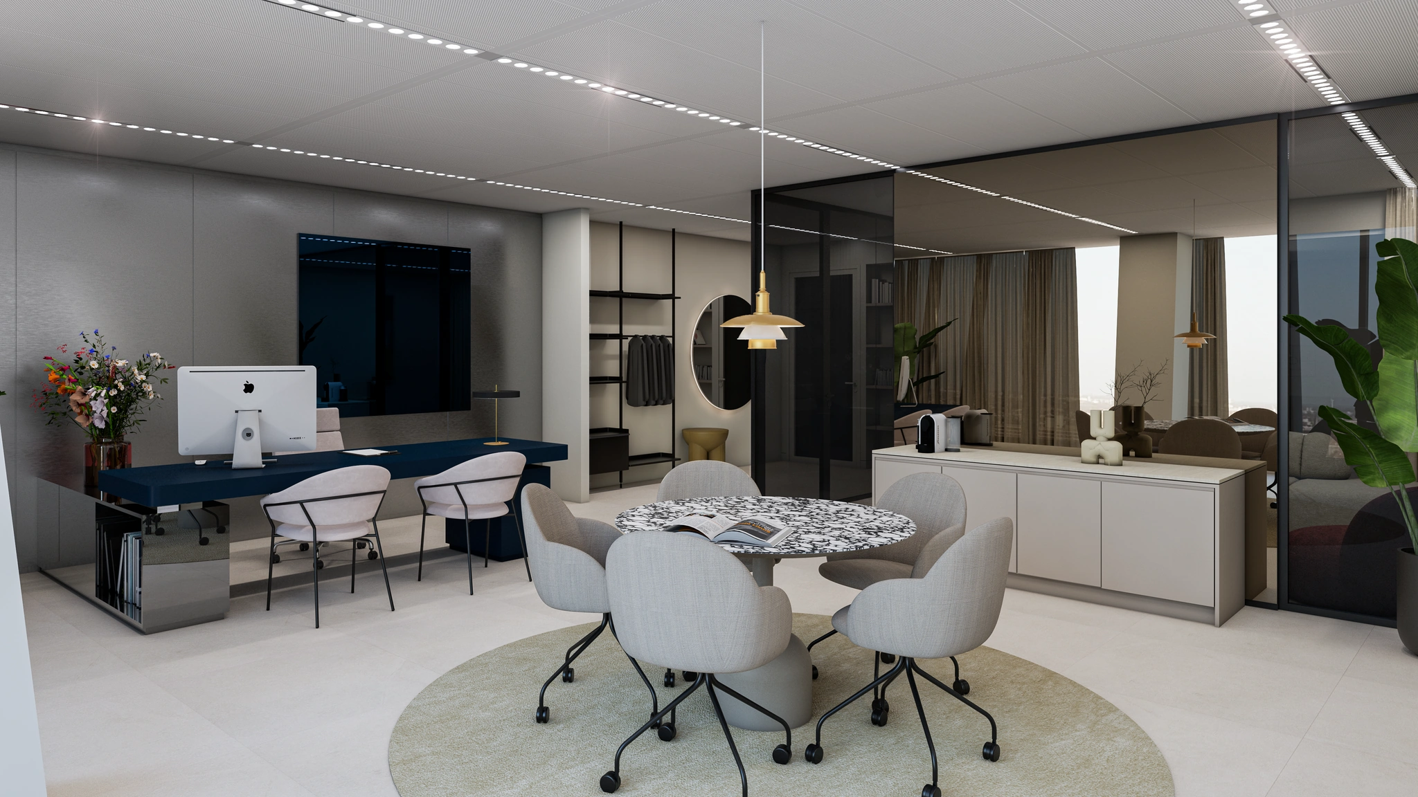 Modern ingerichte kantoorruimte aan de Strawinskylaan met een werkplek, vergadertafel en strakke designmeubels.