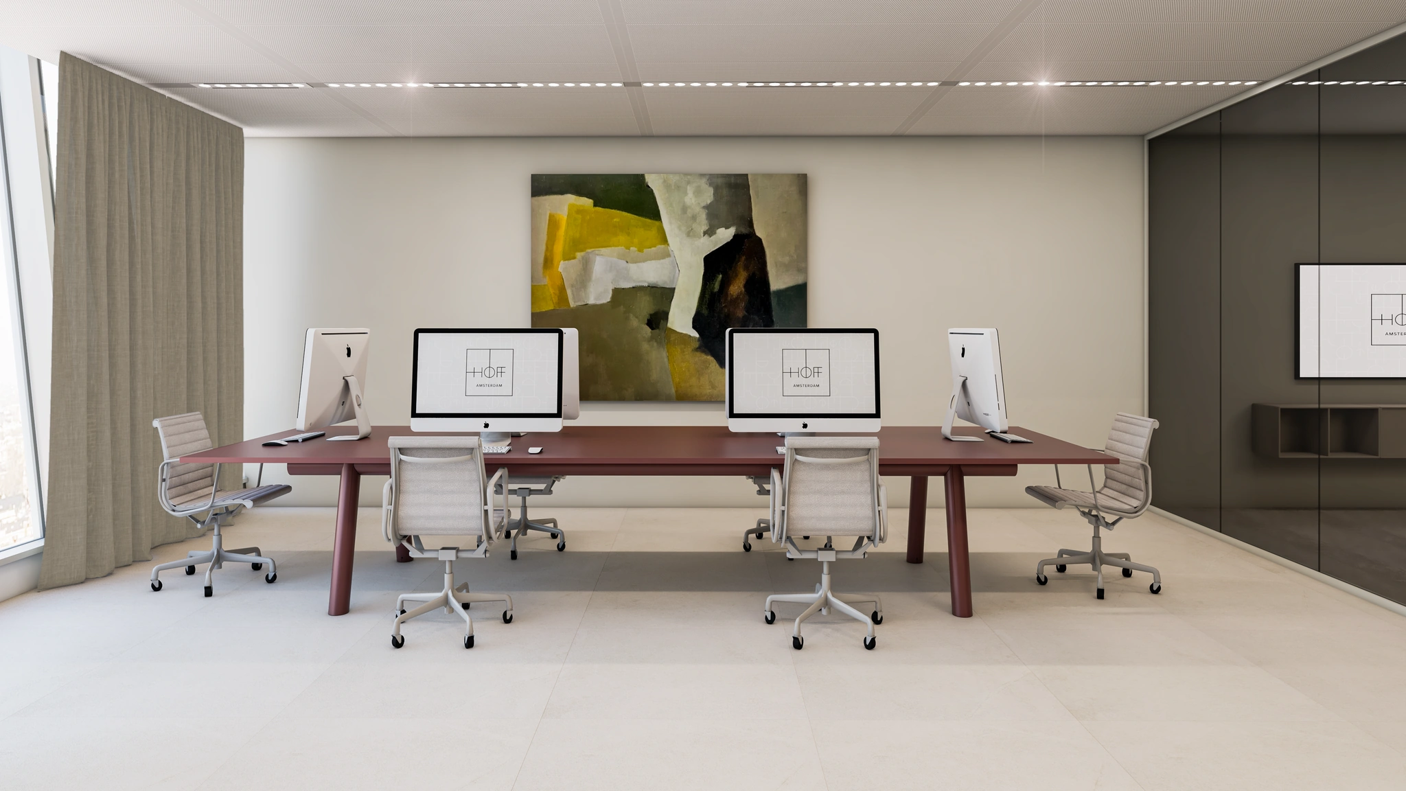 Moderne kantoorruimte aan de Strawinskylaan met werkplekken, iMacs en abstract schilderij aan de wand.