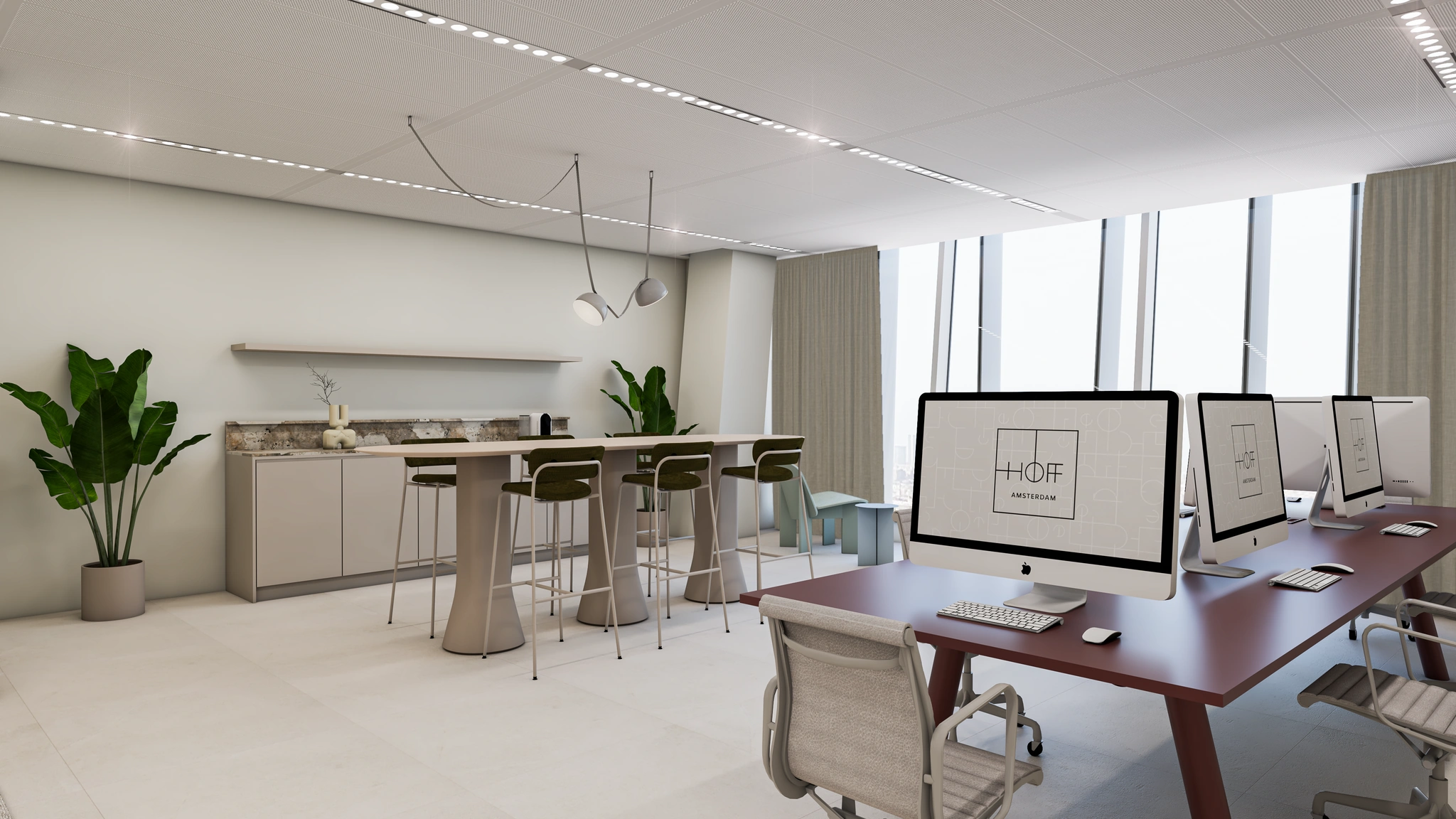 Moderne kantoorruimte aan de Strawinskylaan met werkplekken, een hoge vergadertafel en een kitchenette.