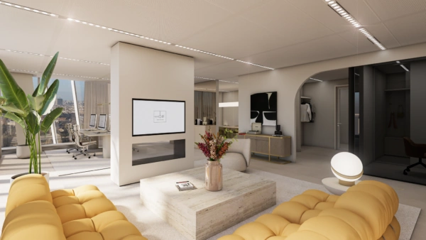 Modern en licht interieur van een luxe kantoorruimte aan de Strawinskylaan met gele designbanken, een centrale open haard en uitzicht op de stad.