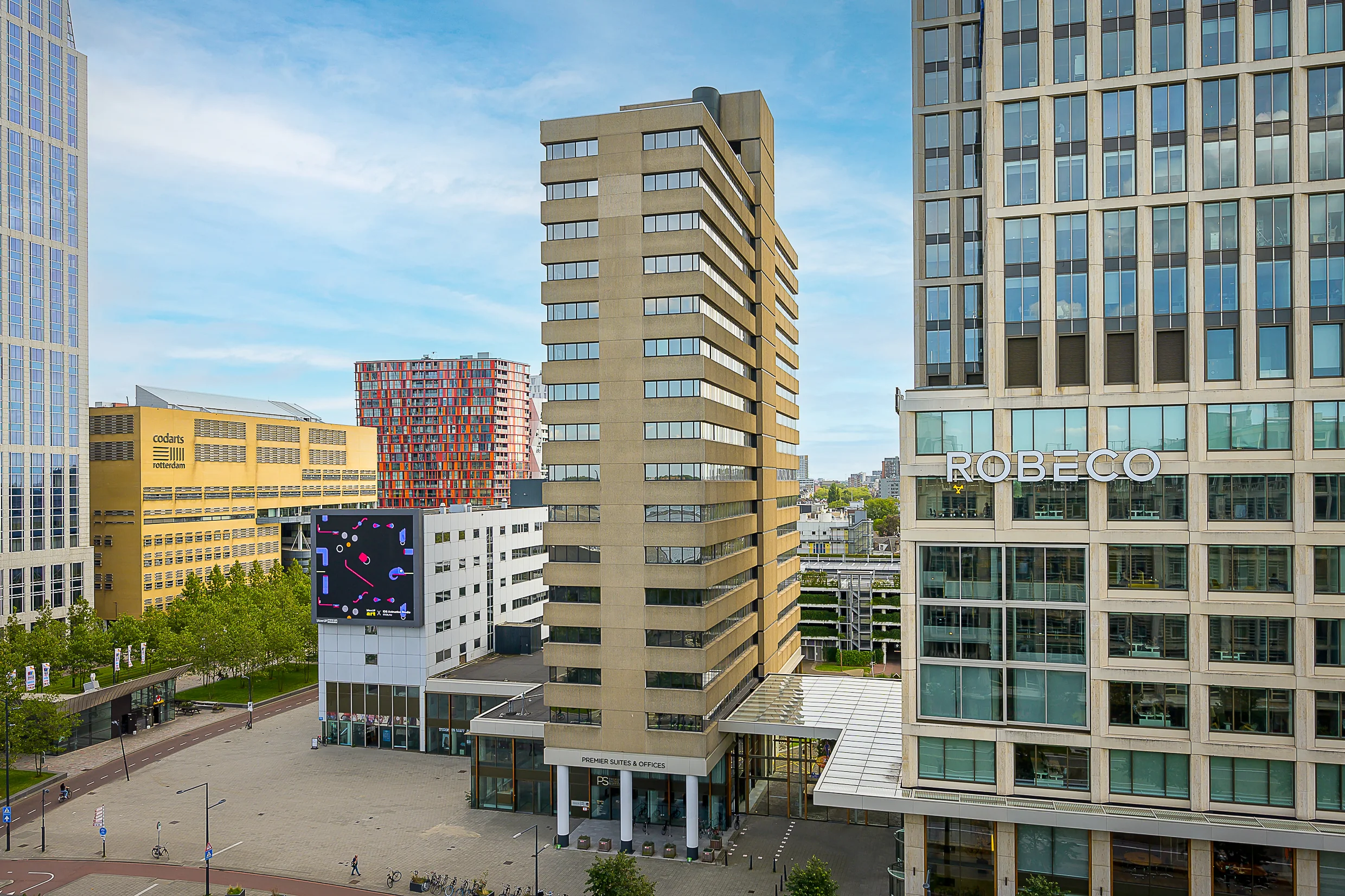 View of modern office buildings on Weena street in Rotterdam, including the Robeco Tower and Codarts arts university.