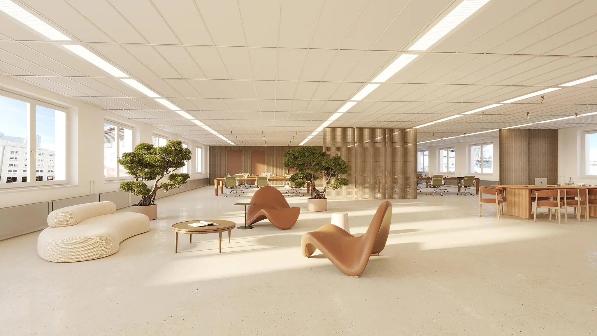 Modern en licht kantoorinterieur aan de Johan Cruijff Boulevard met designmeubels, planten en open werkplekken.