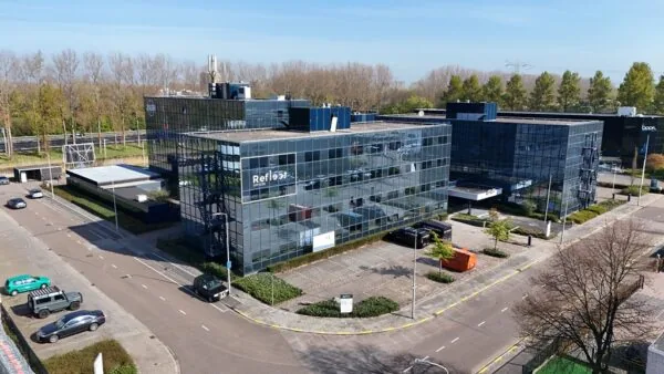 Modern office buildings with reflective glass facades located on Essebaan street.