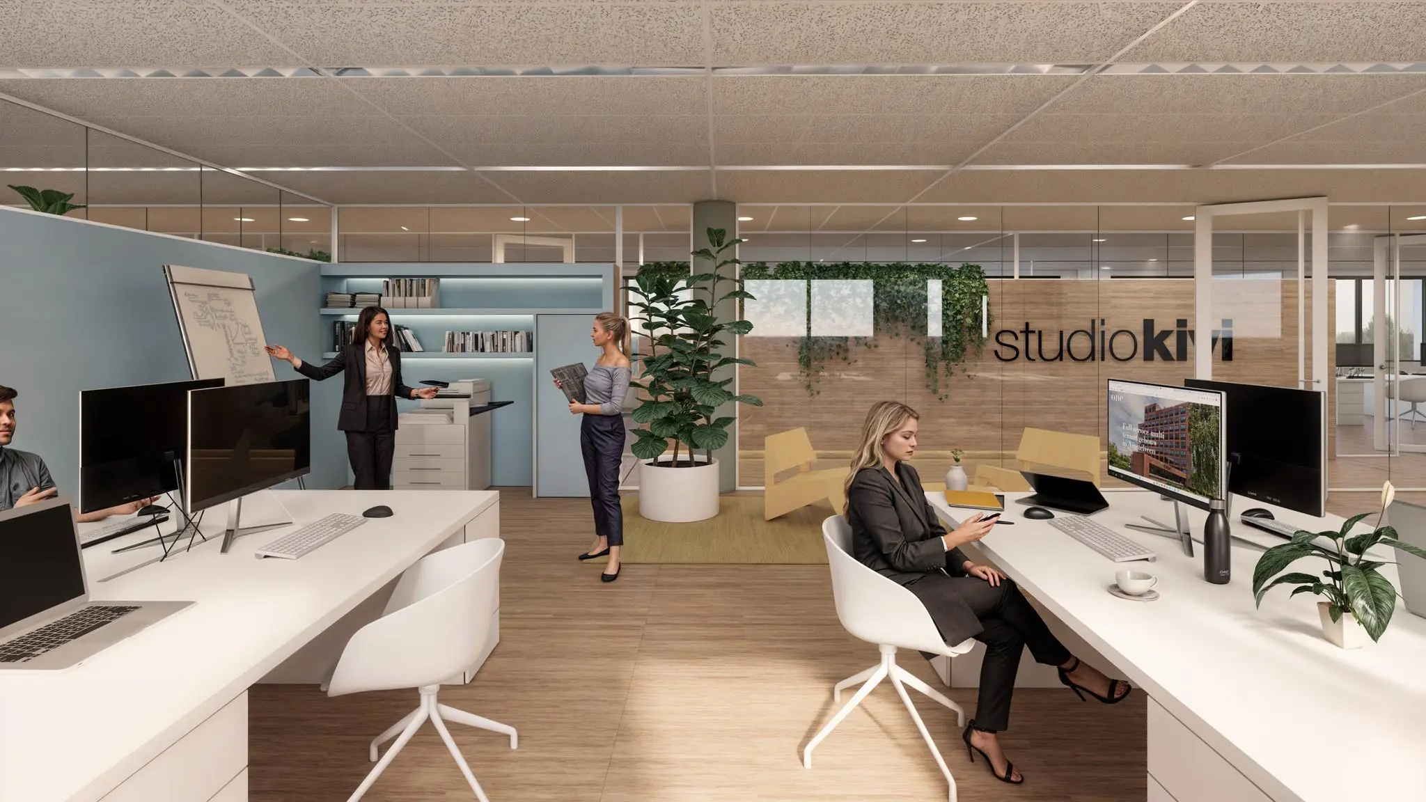 Modern kantoorinterieur van Studio Kiwi met werknemers aan het werk en in overleg bij een whiteboard.