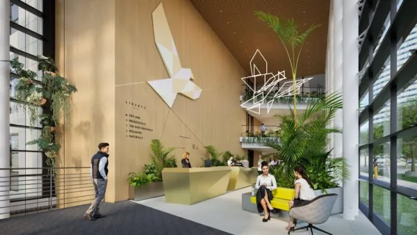 Moderne kantoorentree van De Entree met veel groen, een geometrisch vogelkunstwerk en een receptiebalie.