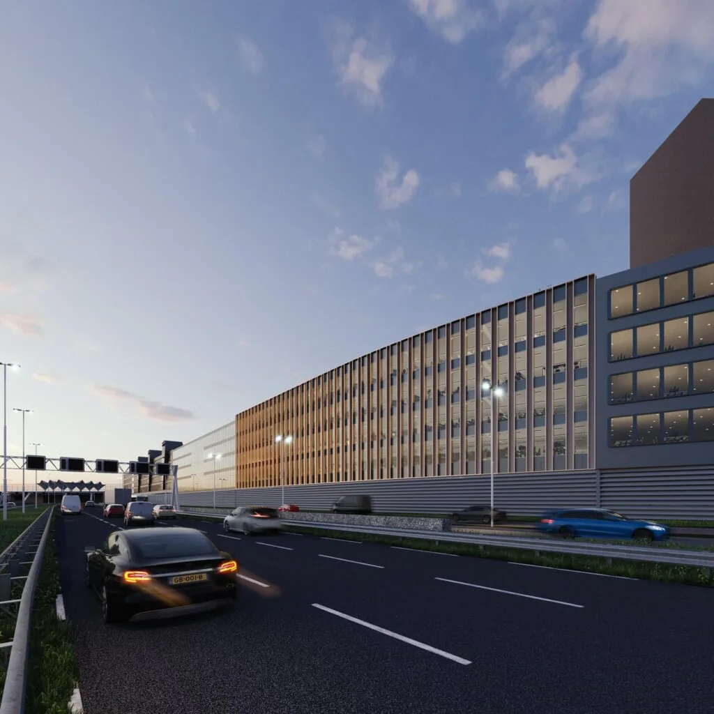 Verkeersbeeld bij schemering met auto's op een snelweg naast een modern kantoorgebouw aan de Reykjavikstraat.